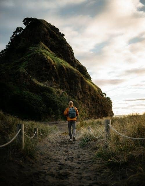 Man hiking up a trail